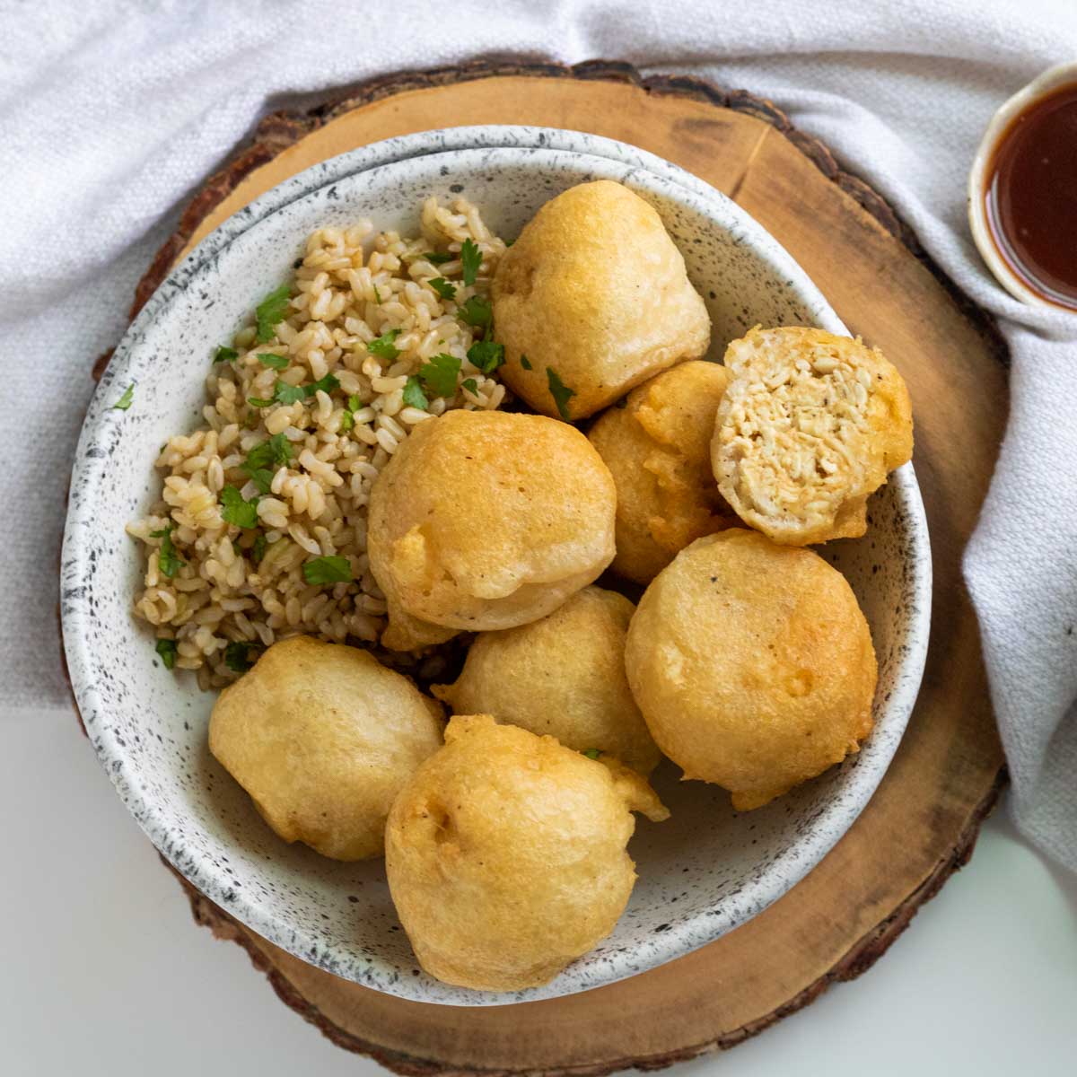 A plate of vegan chicken balls and rice.