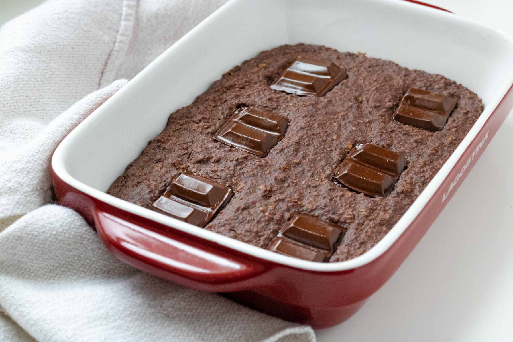 Vegan chocolate baked oats in a baking dish.