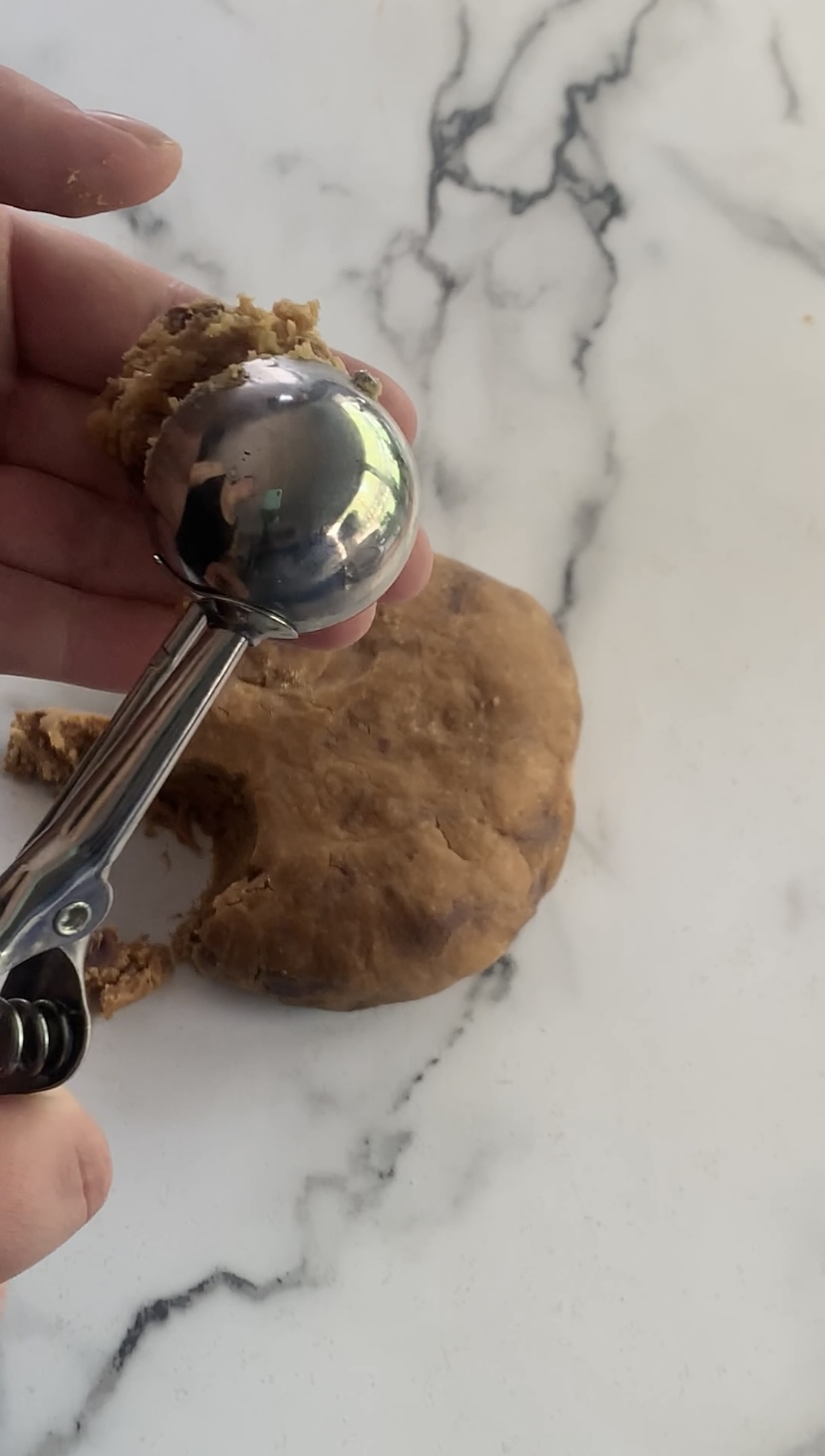 Using a cookie scoop for cookie dough balls.