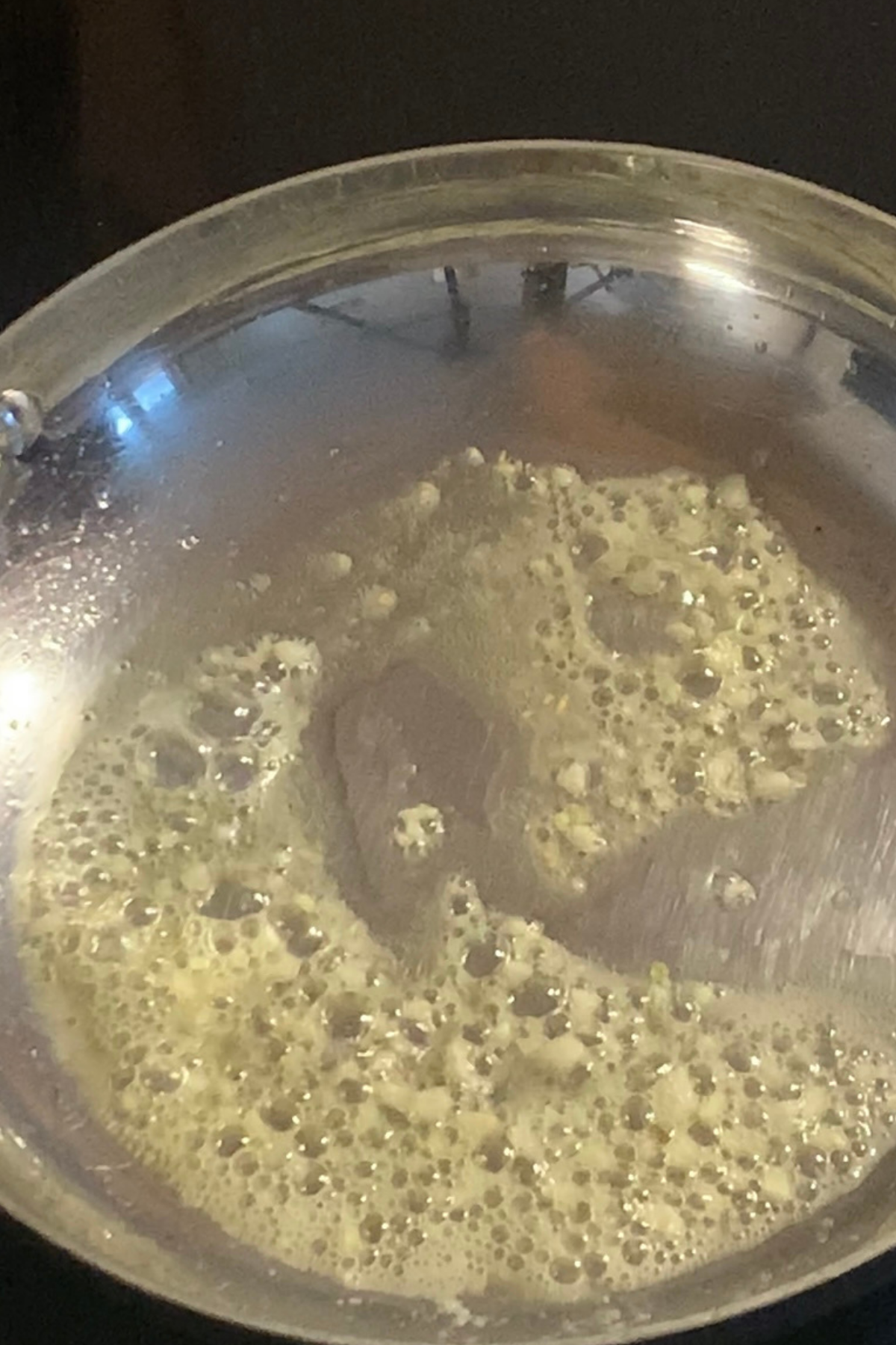 Cooking garlic in vegan butter.