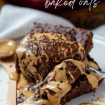 A square of chocolate baked oats on a plate with chocolate and peanut butter drizzle.