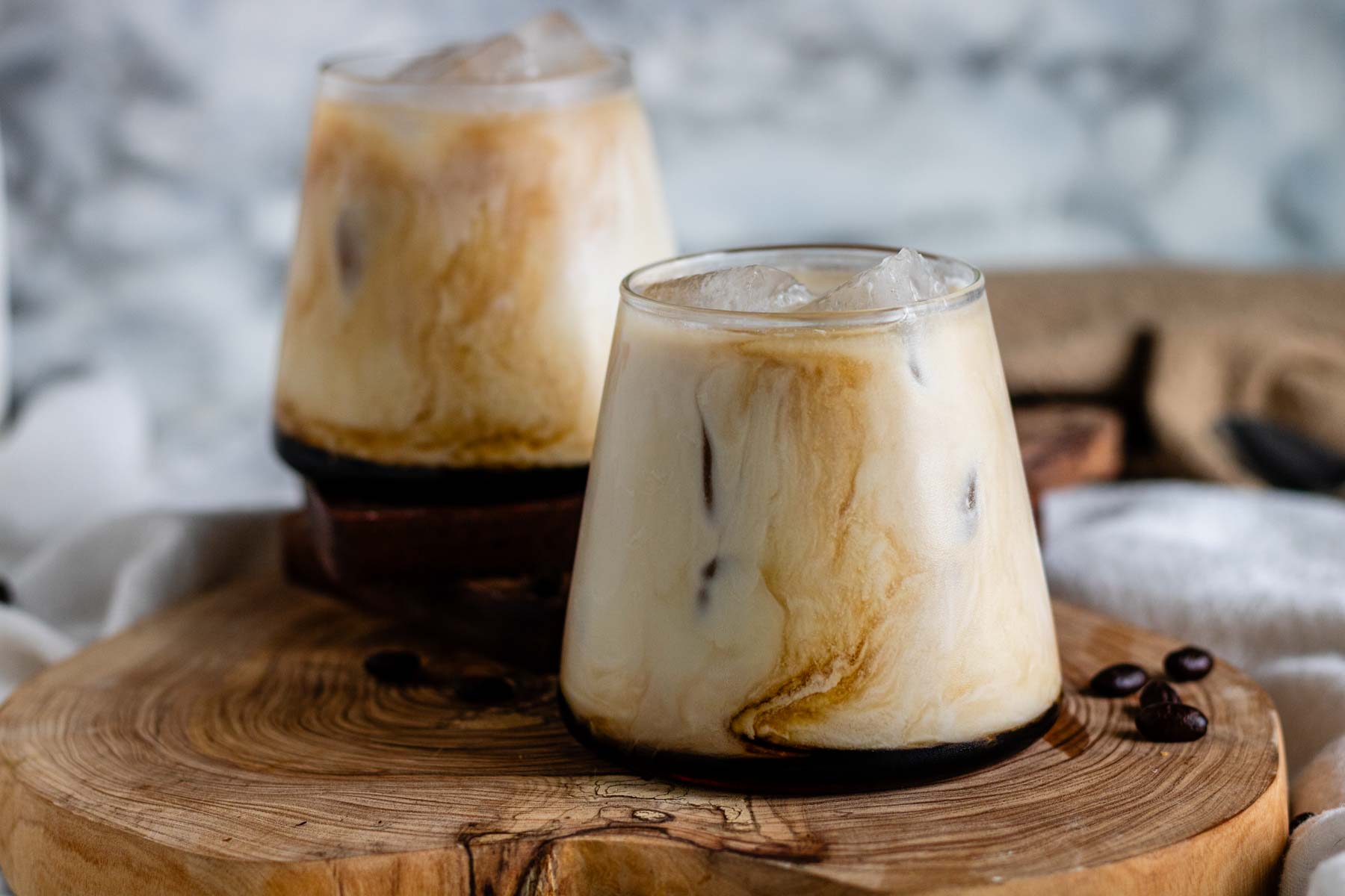 Dairy free white Russian on a wooden board.