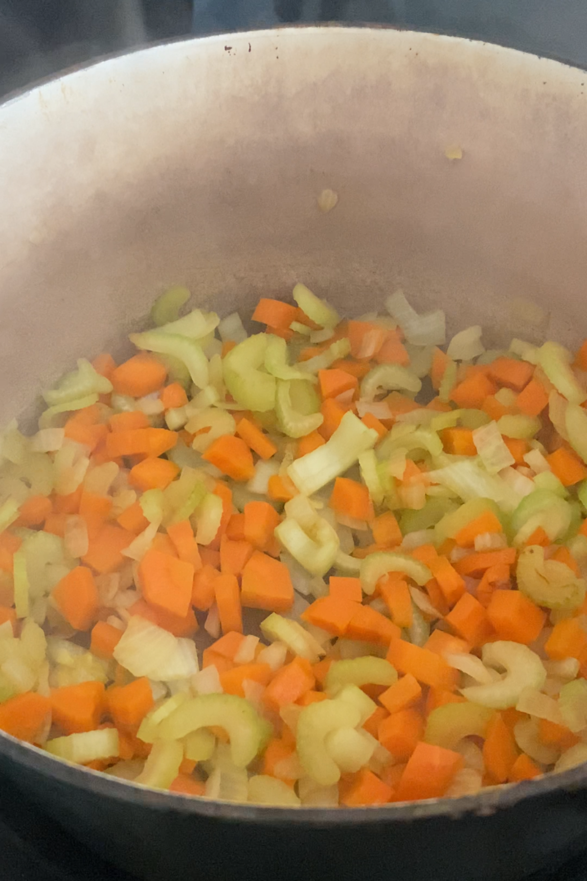 Cooking celery, carrots and onion.