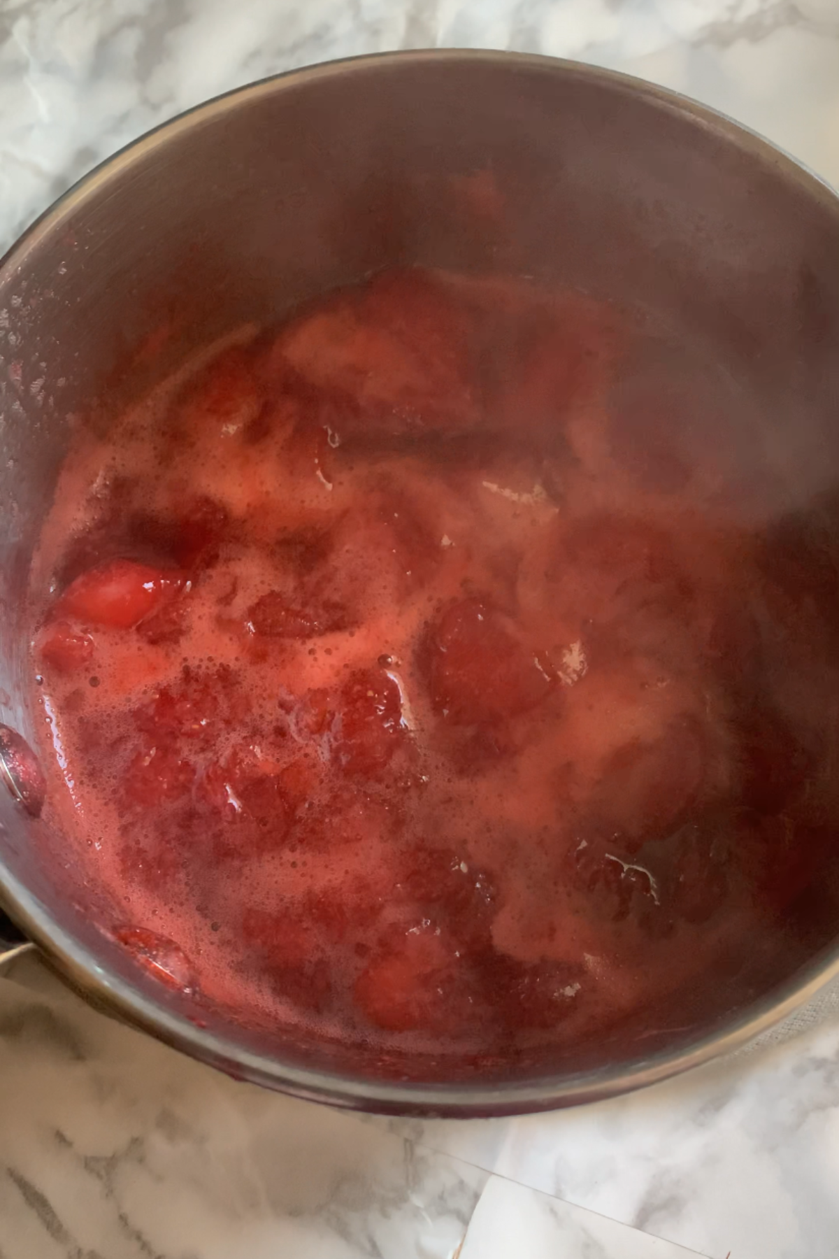 Making the strawberry sauce.