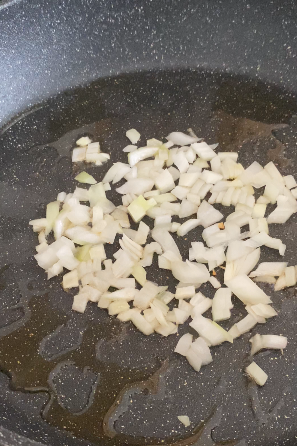 Cooking onion for vegan lumpia.
