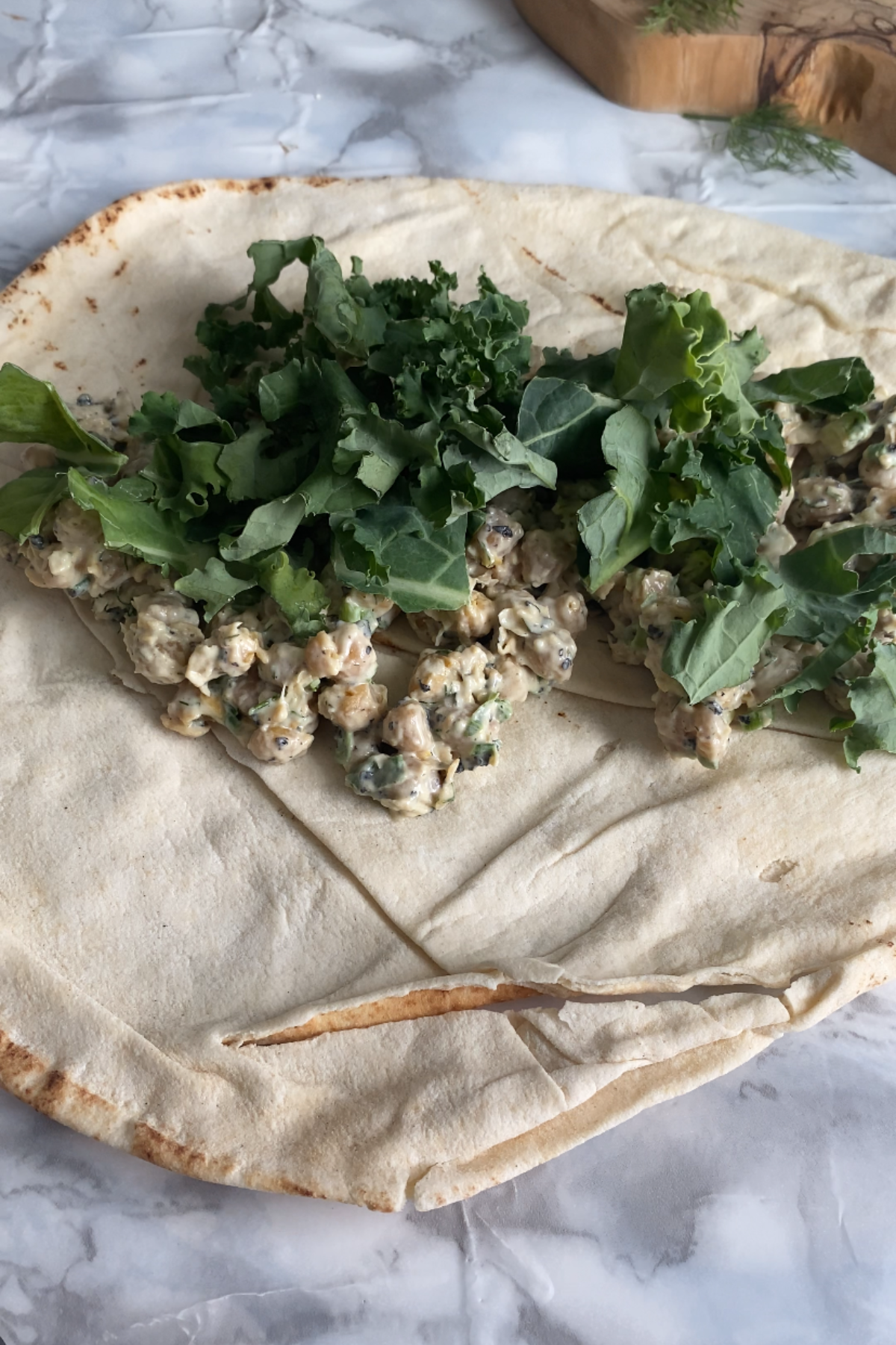 Kale and chickpea tuna on a large wrap.