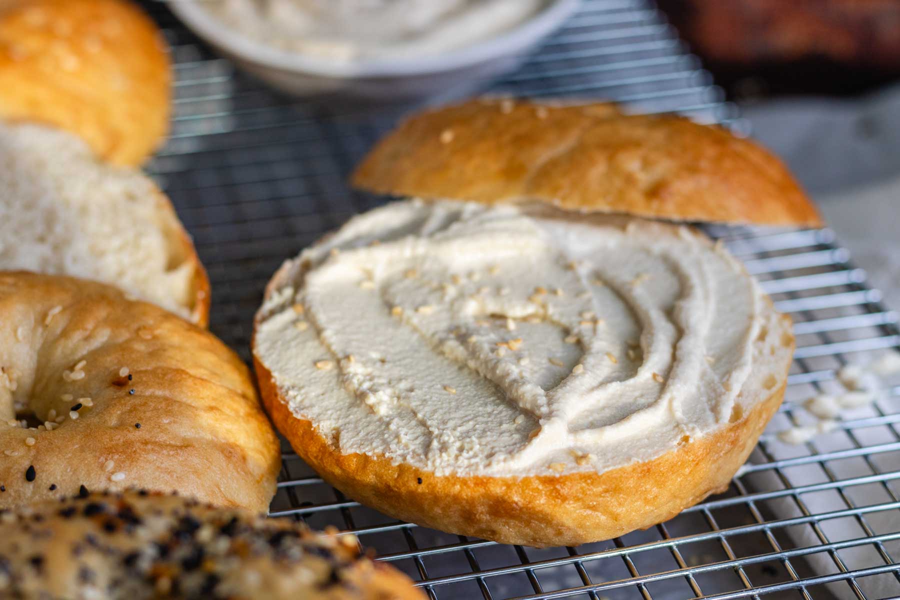 Close up of vegan cream cheese on a bagel.