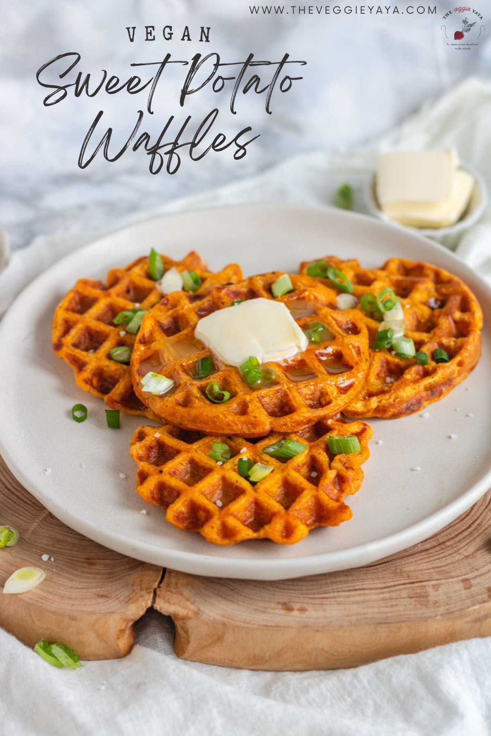 Four sweet potato waffles on a plate with black text overlay.