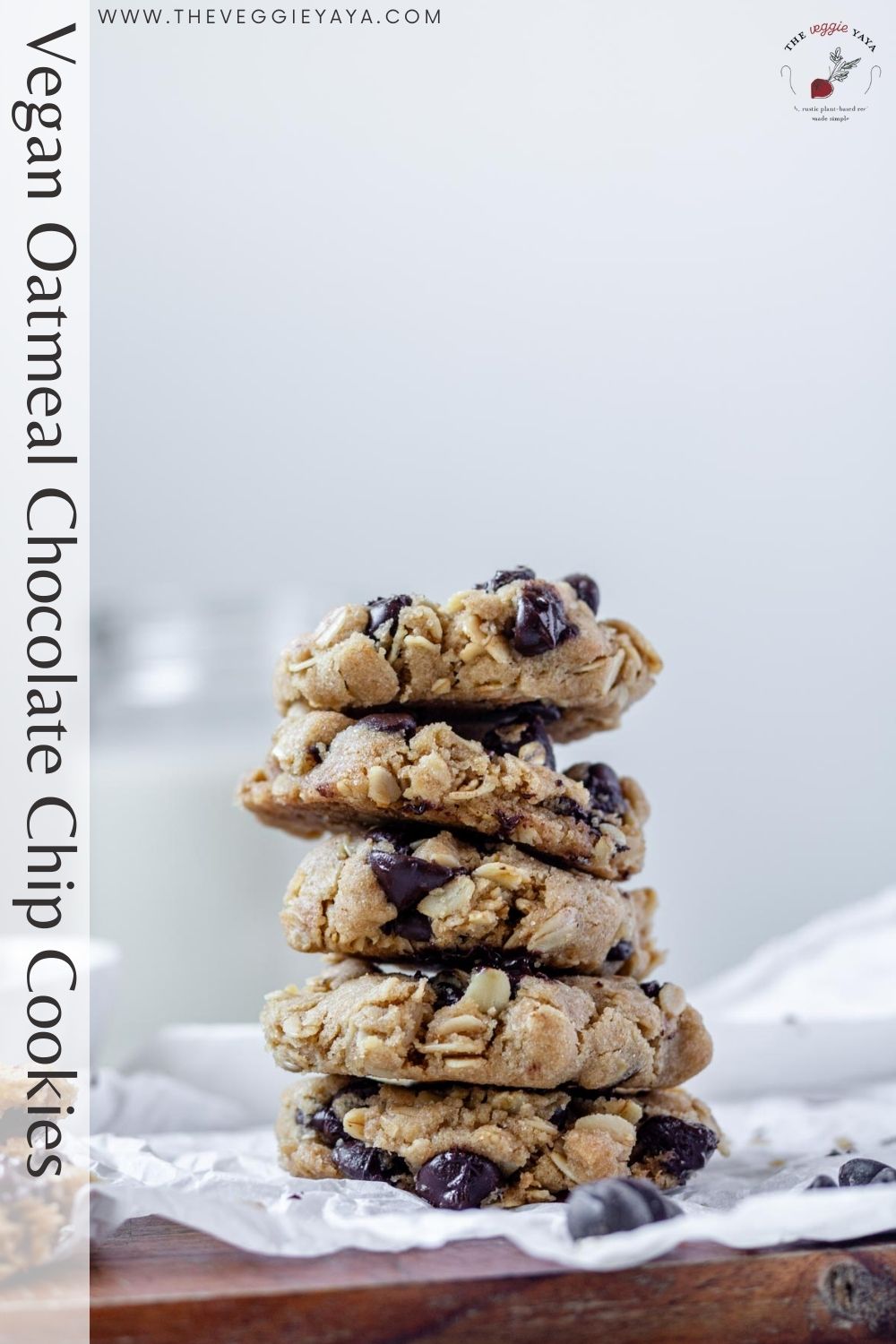 Vegan oatmeal chocolate chip cookies stacked with black text along the side of the image.