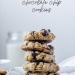 Vegan oatmeal chocolate chip cookies stacked with dark grey text at the top of the image.