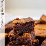 Three pumpkin brownies stacked on top of each other with black text along the left side of the photo.