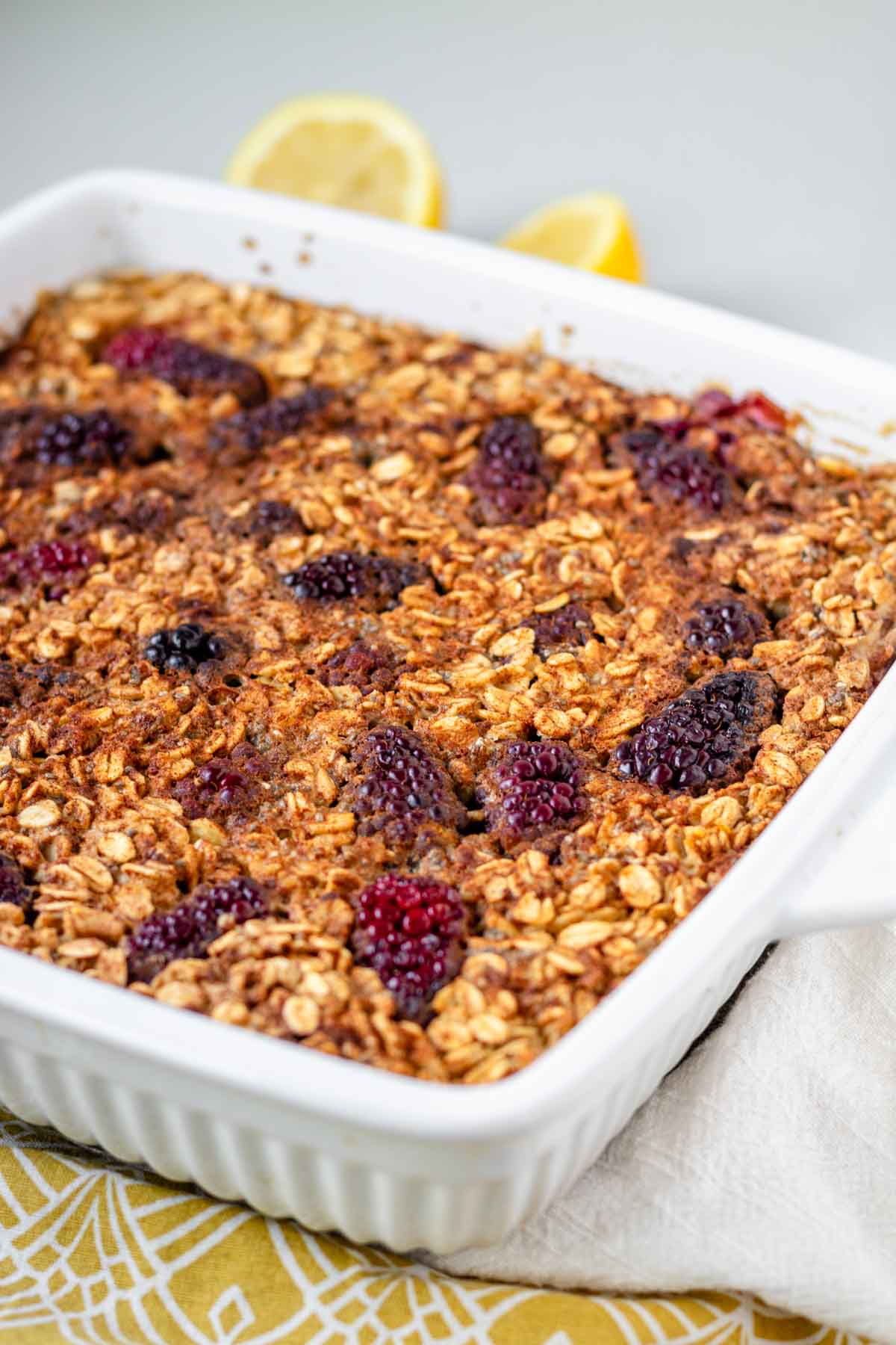 Blackberry baked oatmeal in a white baking dish.