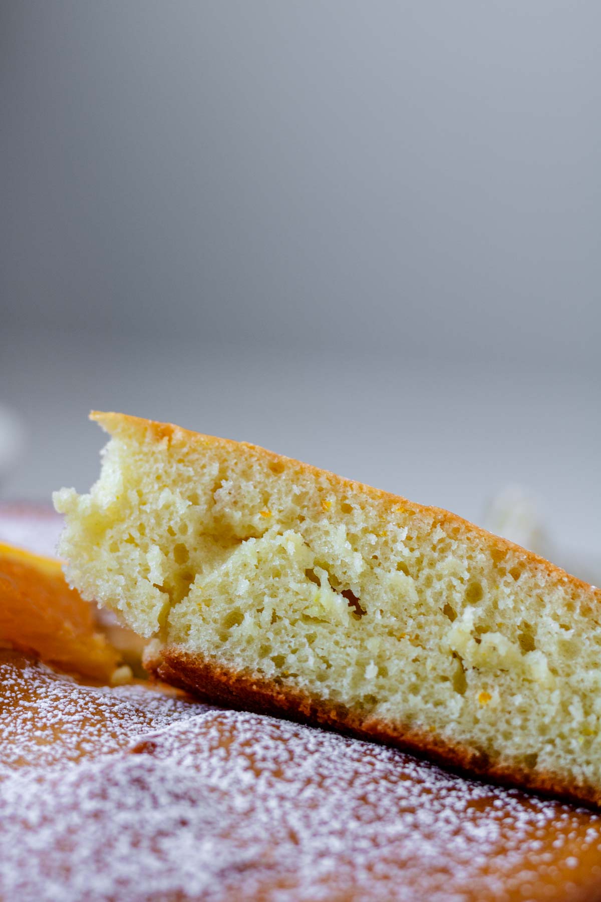 A slice of orange blossom cake, showing the crumb.